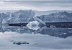 This fine-art photograph provides a beautiful view on icebergs at the Sermilik fjord in East-Greenland.