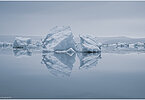 This fine-art photograph provides a beautiful view on icebergs at the Sermilik fjord in East-Greenland.