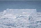 This fine-art photograph provides a beautiful view on icebergs at the Sermilik fjord in East-Greenland.