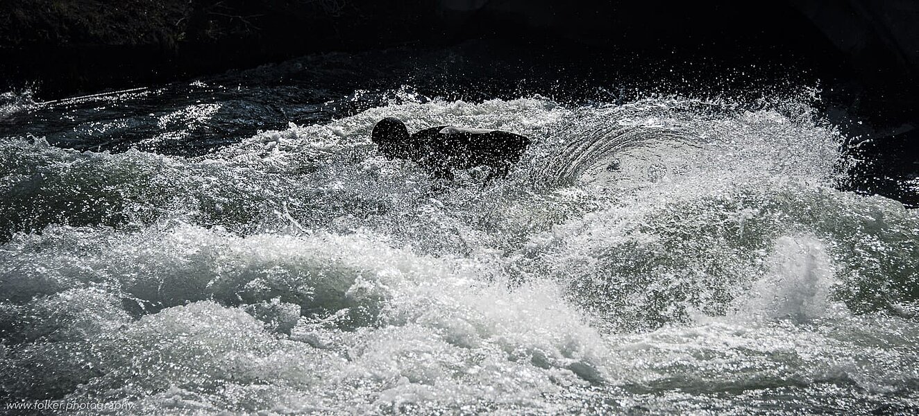 Surfer at the standing wave, "Eisbach" English garden, Munich Surfer at the standing wave, "Eisbach" English garden, Munich