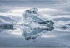 This fine-art photograph provides a beautiful view on icebergs at the Sermilik fjord in East-Greenland.