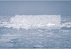 This fine-art photograph provides a beautiful view on icebergs at the Sermilik fjord in East-Greenland.